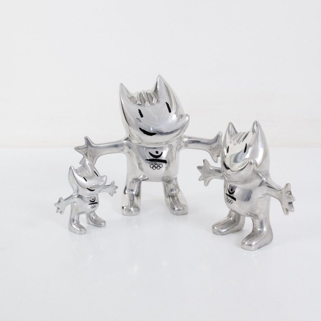 Javier Mariscal, Three mascots 'Cobi' for the 1992 Barcelona Olympic Games, 1988 (design): <p>H. 14.5, 23, 30 cm. <br />Pilma, Barcelona. <br />Cast aluminum. <br />Marked: pilma, &copy; 1988, 92 sa tm (3x).</p>