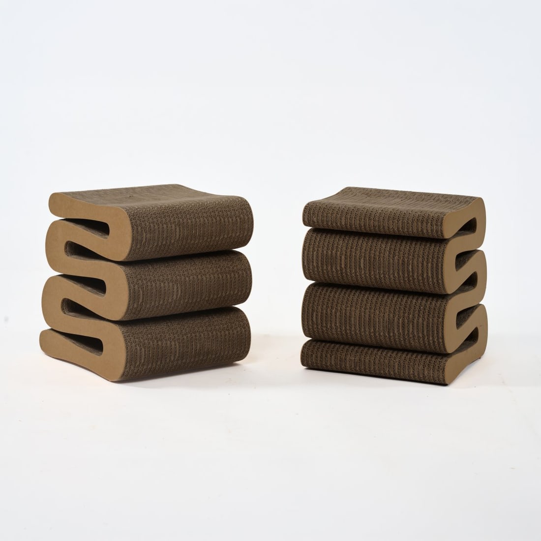 Frank O. Gehry , Two stools 'Wiggle Side Stool', 1972 (design) (1 of 6)