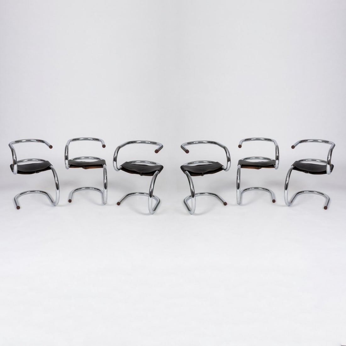 Wim van den Berg, Six chairs 'Monotube', 1981 (design): <p>H. 72 x 47 x 70 cm. <br />Netherlands. <br />Chrome-plated metal tube, black leather, cherry wood.<br />Marked: L2 (embossed). </p>