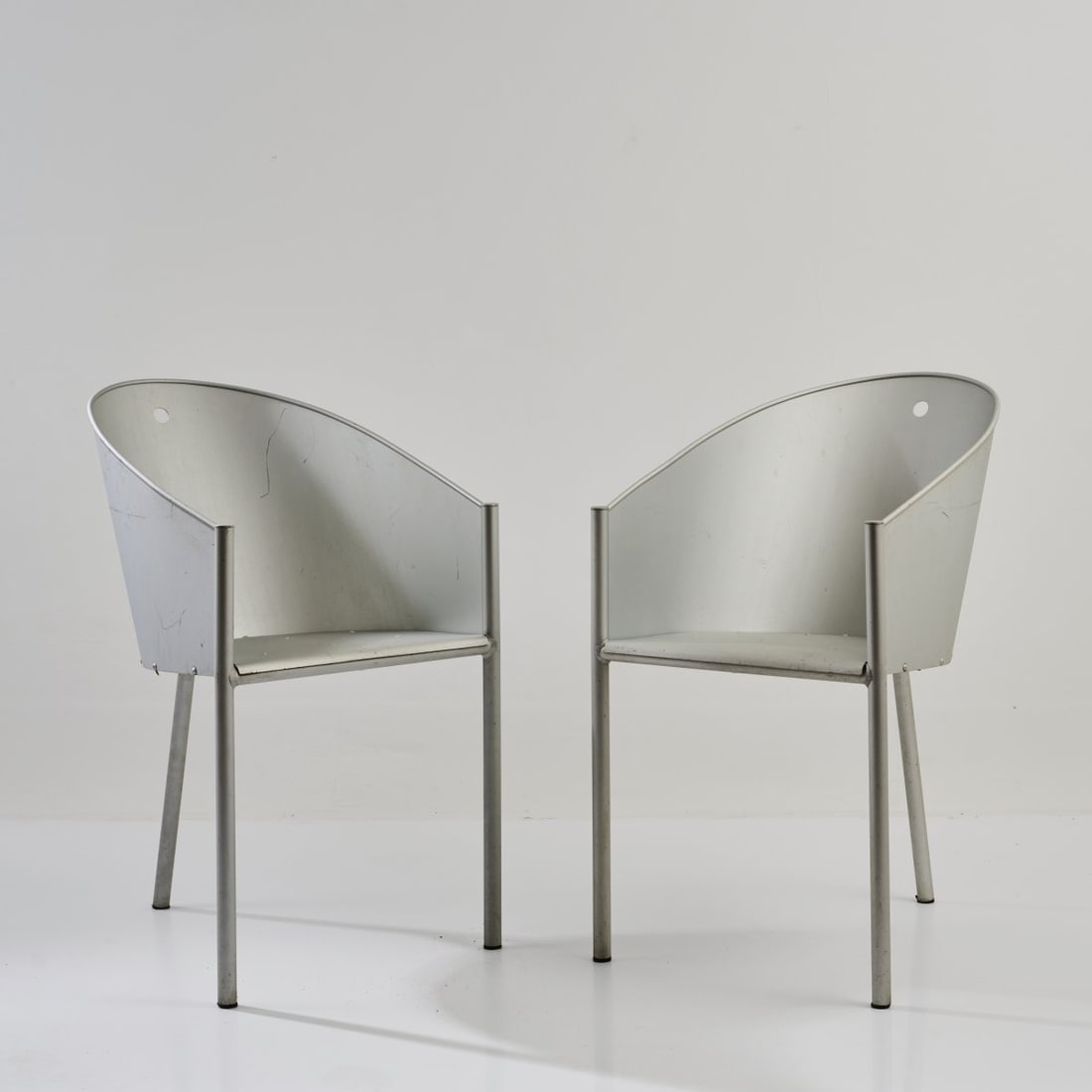 Philippe Starck, Two armchairs 'Costes', 1982 (design): <p>H. 80 x 46 x 56.5 cm. <br />Driade Aleph, Caorso. <br />Aluminum sheet, aluminum tube. <br />Marked: Embossed with manufacturer's information and facsimile signature.</p&