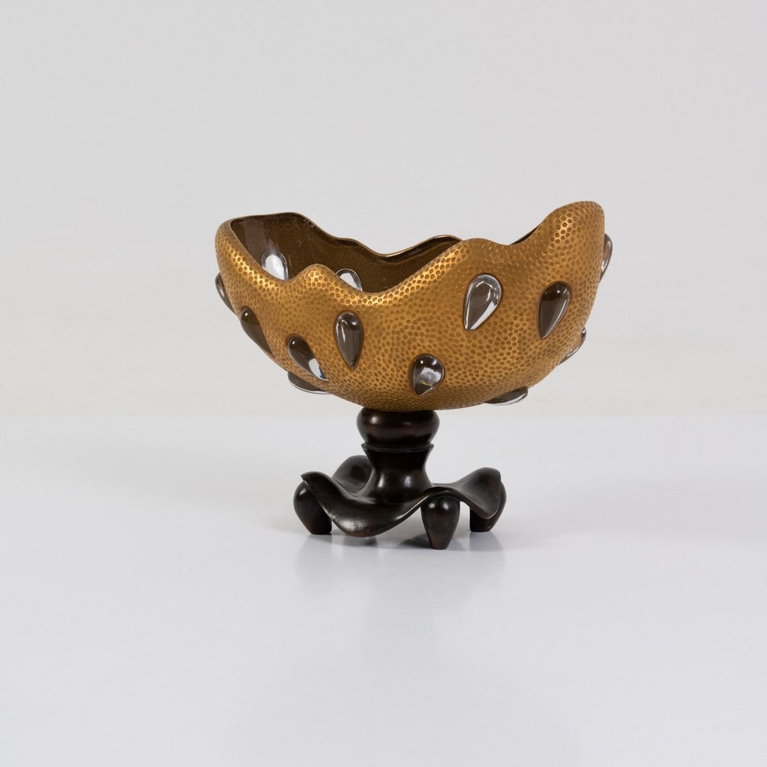 André Dubreuil, Bowl 'Lacrima', 1991 (design): <p>H. 29.5 x 38.5 x 17.5 cm.<br />Cristallerie Daum, Paris. <br />Bronze, patinated, colorless and gilded glass. <br />Marked: artist's mark, manufacturer's name, numbered 7/10