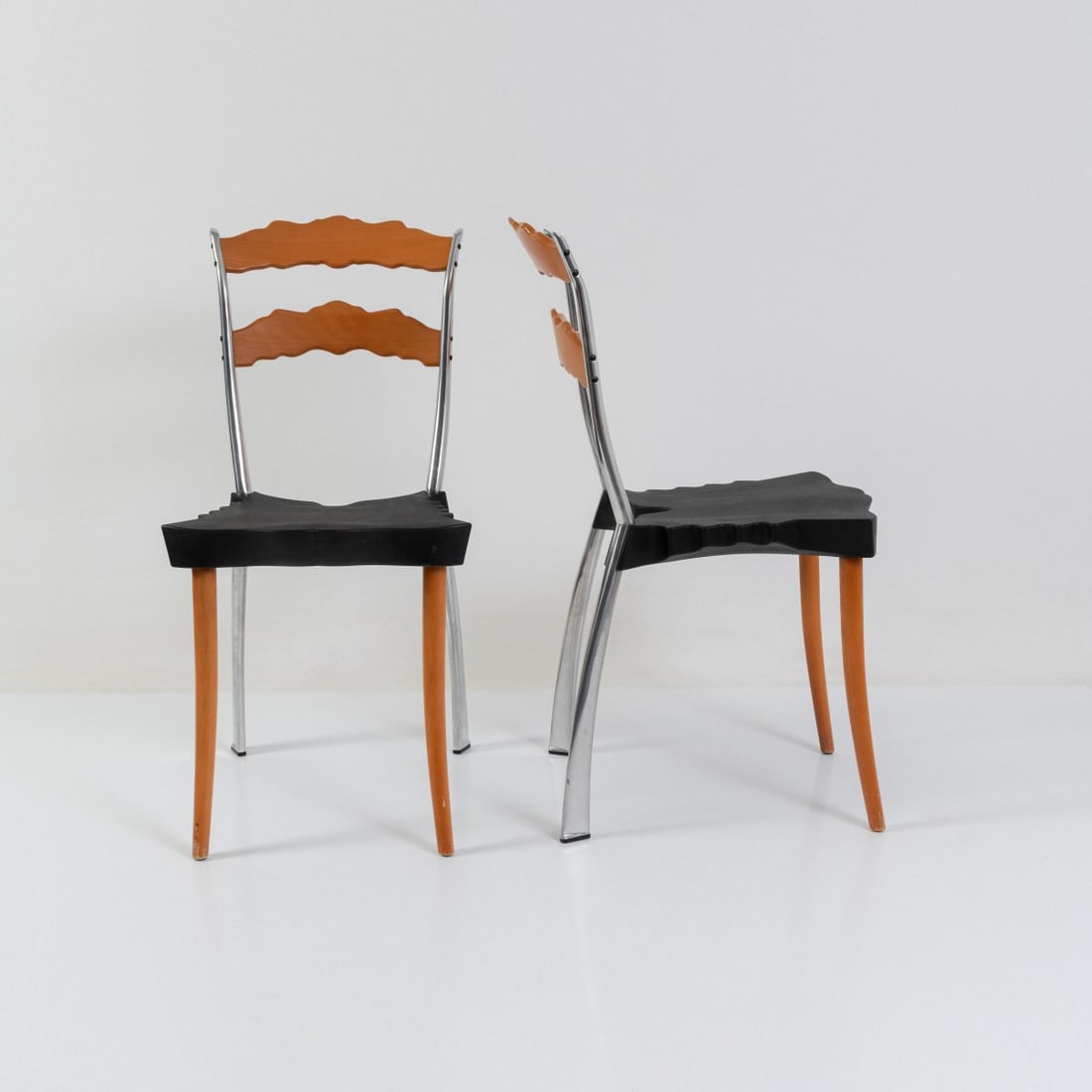 Bo?ek Šípek , Two chairs 'Sedlak', 1992 (design): <p>H. 89 x 43 x 53.5 cm. <br />Vitra, Birsfelden, 1995. <br />Cast aluminum, beechwood, rubber, black. <br />Marked: Manufacturer's details with object information (embossed), 