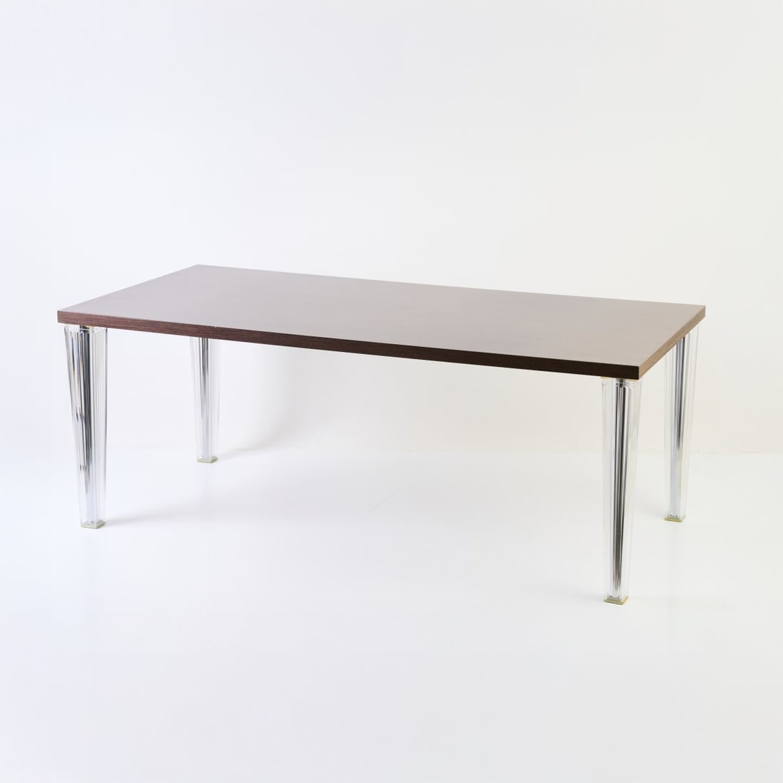 Philippe Starck, Table 'Top Top', 2005 (design): <p>H. 73 x 190 x 90 cm. <br />Kartell, Noviglio.<br />Acrylic (PMMA), mahogany laminate. <br />Marked: manufacturer's mark with object and designer information. </p>