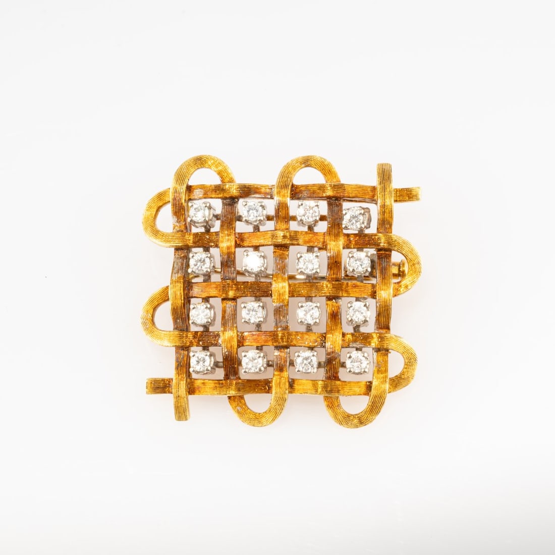 Franco Cannilla (1911 Caltagirone - 1984 Rome), Brooch with diamonds, 1960s: <p>18k yellow gold (750), 16 round-cut diamonds (total approx. 0.60 ct., calculated weight). <br />12.97 grams. 25 x 25 mm. <br />Stamped: 750, workshop
