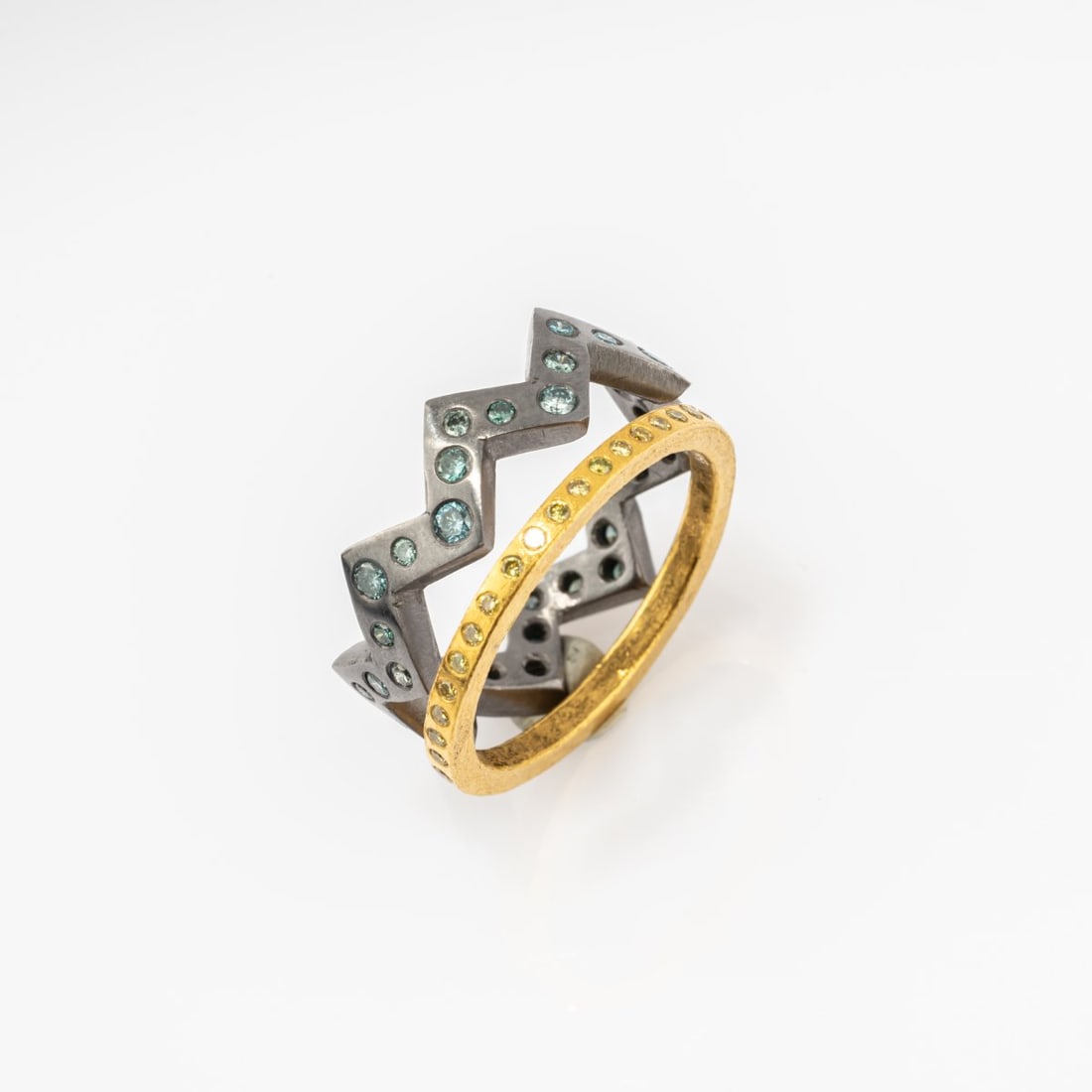 Peter Hassenpflug (1932 Wuppertal - lives in Dusseldorf), Two rings 'Round and Zigzag Duo', 2003: <p>Tantalum, fine gold, blue and yellow diamonds. <br />Total weight 9.33 grams. Ring size 57.5. <br />One ring signed: artist's monogram, Ta. </p>