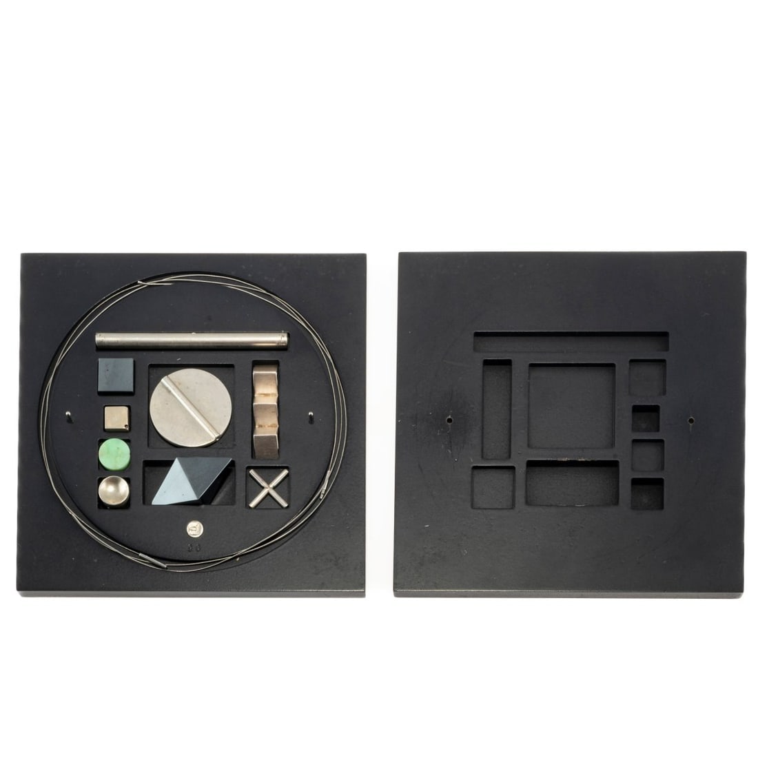 Hermann Jünger (1928 Hanau - 2005 Poering near Munich), 9-piece jewelry box, 1990: <p>9 pendants (6 silver, 2 hematite, 1 jadeite), 2 Niessing cords, platinum 950. <br />Pendants H. 9-80 mm. Necklaces L. 445 and 550 mm. <br />Box stamped: artist's signet, 90.</p