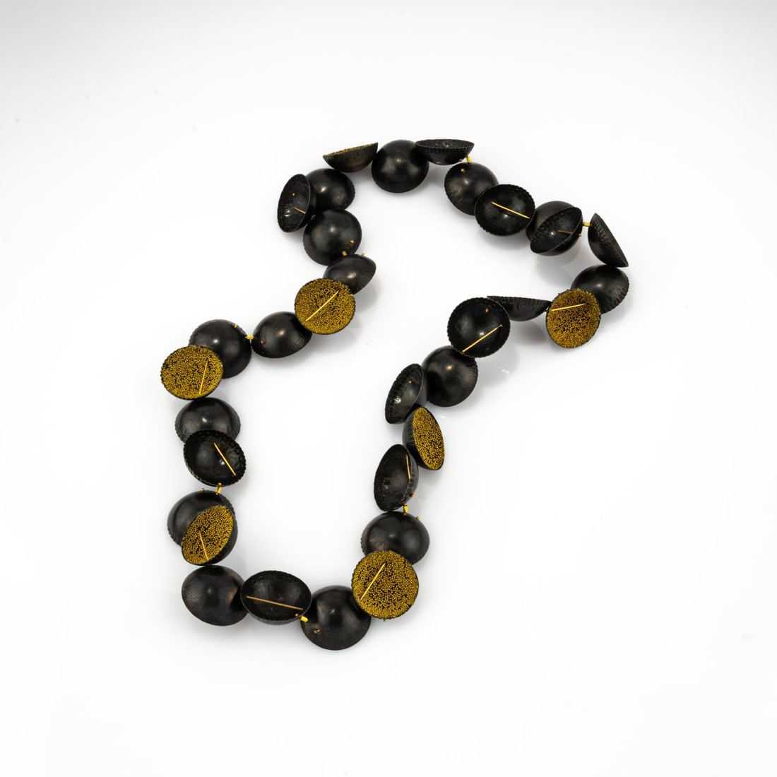 Annamaria Zanella (1966 Padova - 2022 Sant'Angelo di Piove), Necklace 'Venetian Yellow', 2007: <p>Iron caps, gold, glass micro beads, enamel. <br />85.27 grams. L. approx. 350 mm, half-shells &Oslash; 28 mm. <br />Signed: Zanella