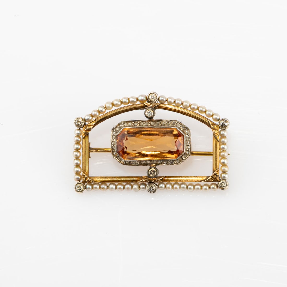 , Brooch, 1890 ca: <p>Gold, silver, seed pearls, diamond chips, golden citrine. <br />6.84 grams. 23 x 36 mm. <br />Stamped: Workshop mark AW.</p>