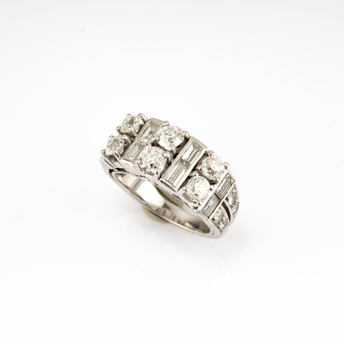 , Alliance ring with diamonds: <p>8k white gold (333) (tested), old european cut and baguette-cut diamonds (total approx. 2.3 ct., calculated weight). <br />6.41 grams. Ring size 49.5. </p>