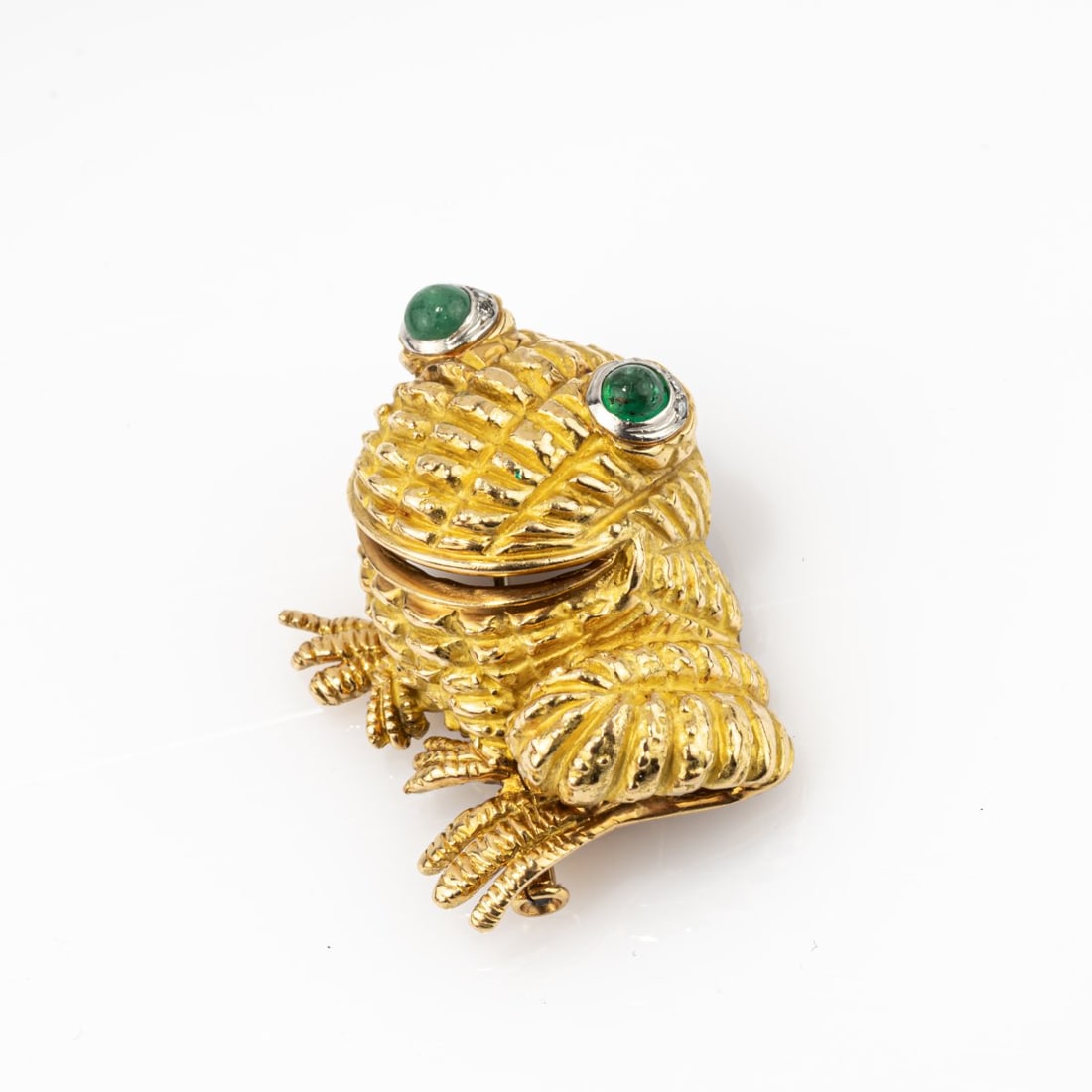 Georges Richards Company, Paris , 'Grenouille' brooch: <p>18k yellow gold (750), platinum, emerald cabochons, diamond chips. <br />16.75 grams. 31 x 29 mm. <br />Stamped: 750, workshop mark, French export marks for gold and