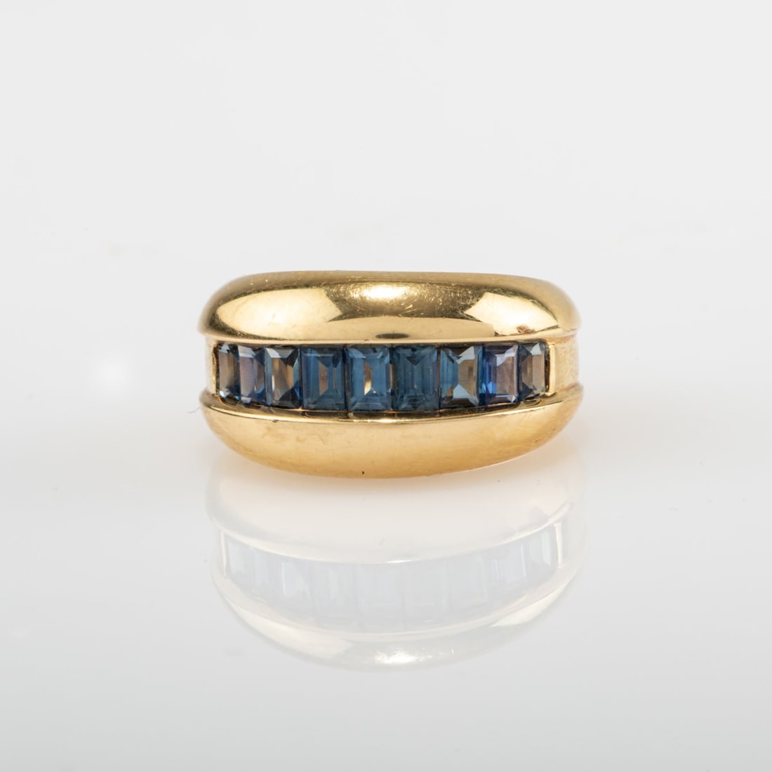 Cartier, Paris , 'Odin' ring with sapphires, 1980s: <p>18k yellow gold (750), eight baguette-cut sapphires. <br />7.6 grams. Ring size 52. <br />Stamped: 750, Cartier, model no., 52.</p>