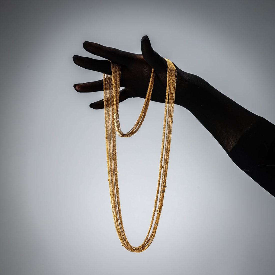 Paul Binder, Zurich, Multi-layered Diamond Necklace, 1980: <p>18k rose gold (750), 15 fine chains with 57 set brilliant-cut diamonds (total 3.99 ct.), elaborate pav&eacute;-set clasp with 108 brilliant-cut diamonds (total 2.59 ct.), fine white (F-G)