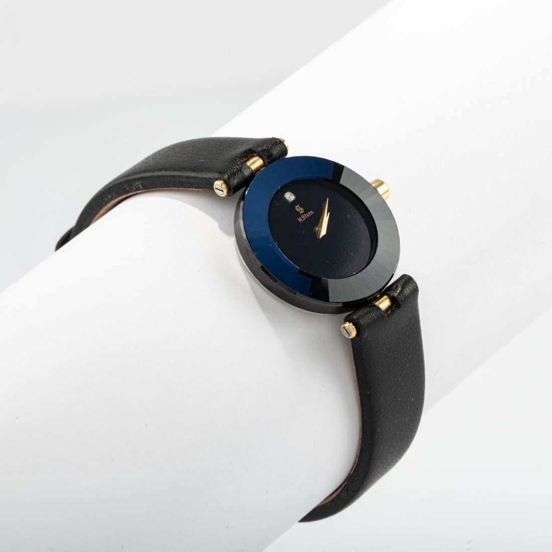 Hans Stern, Brazil, Wristwatch, 1992: <p>Cut sapphire, stainless steel, gold, brilliant-cut diamond, leather band.<br />14.25 grams. Case &Oslash; 25 mm. <br />Case marked: workshop mark, H. Stern, water resistant 20