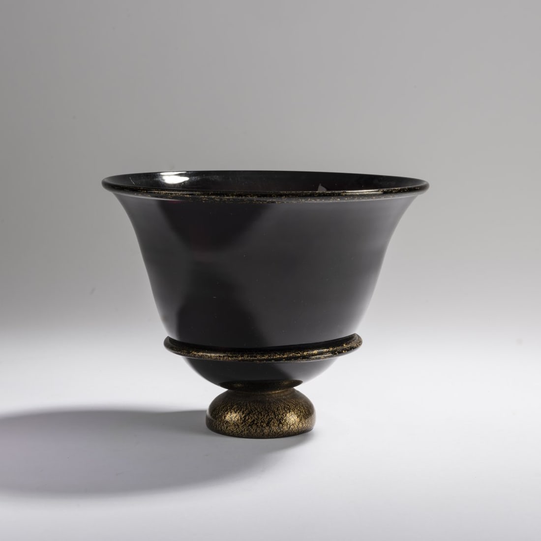 Napoleone Martinuzzi, Vase, c. 1930: <p>Model no. 3288. H. 13.7 cm. Execution: Venini &amp; C. Violet glass, base and fused threads with applied gold foil. Marked: remains of a manufacturer's