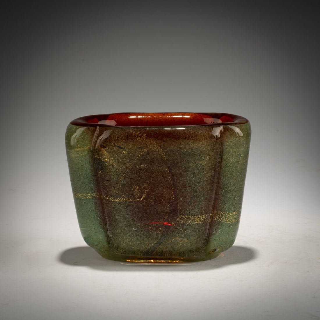 Carlo Scarpa, 'Sommerso oro a bollicine' vase, c. 1934-36: <p>H. 11.4 cm; 15 x 9 cm. Execution: Venini. Cased glass, colorless, deep red and green with finely shattered gold foil and air