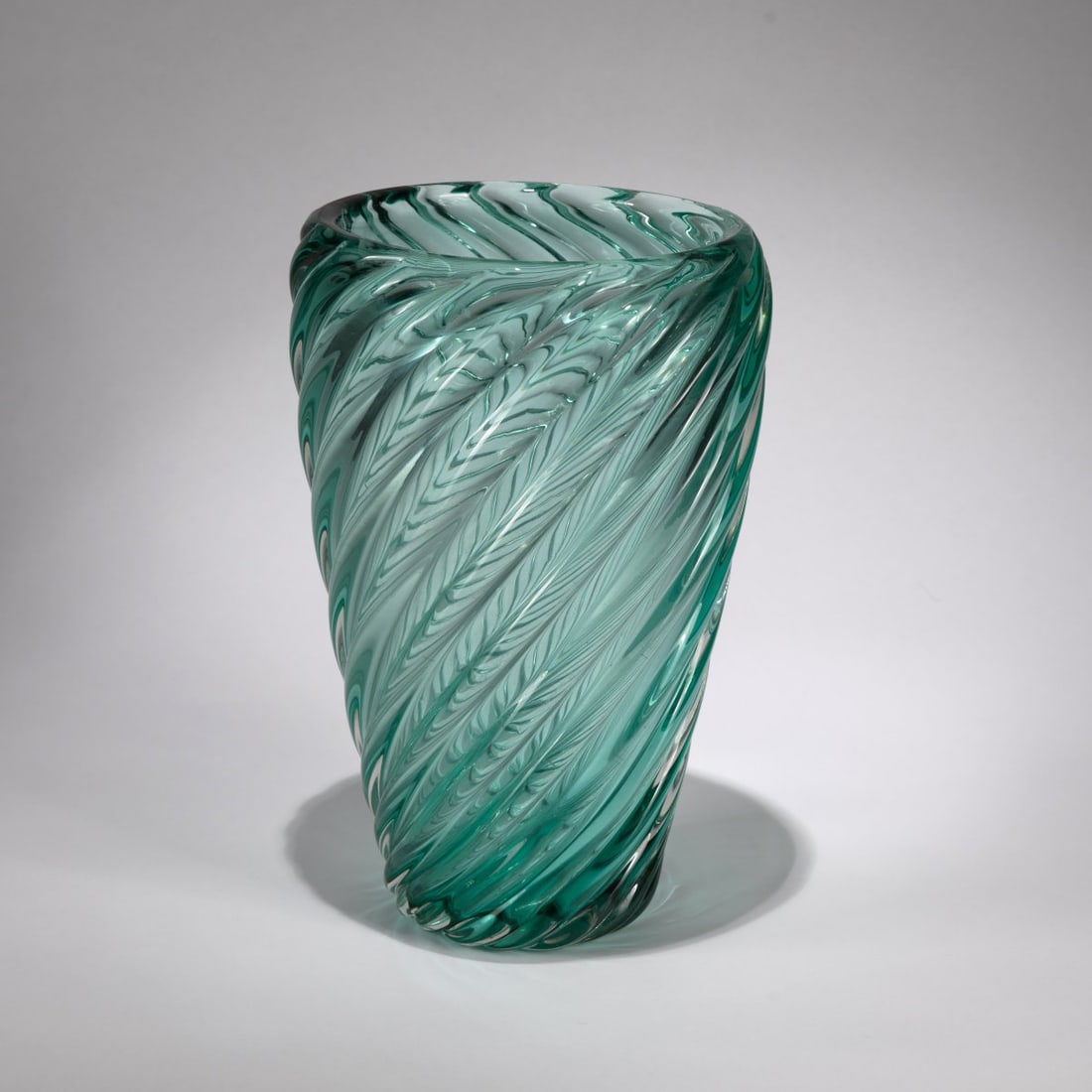 Venini, 'A coste' vase, c.1935: <p>H. 29.5 cm. Diagonally ribbed cased glass, colorless and green. Marked: venini murano MADE IN ITALY (acid stamp).</p>