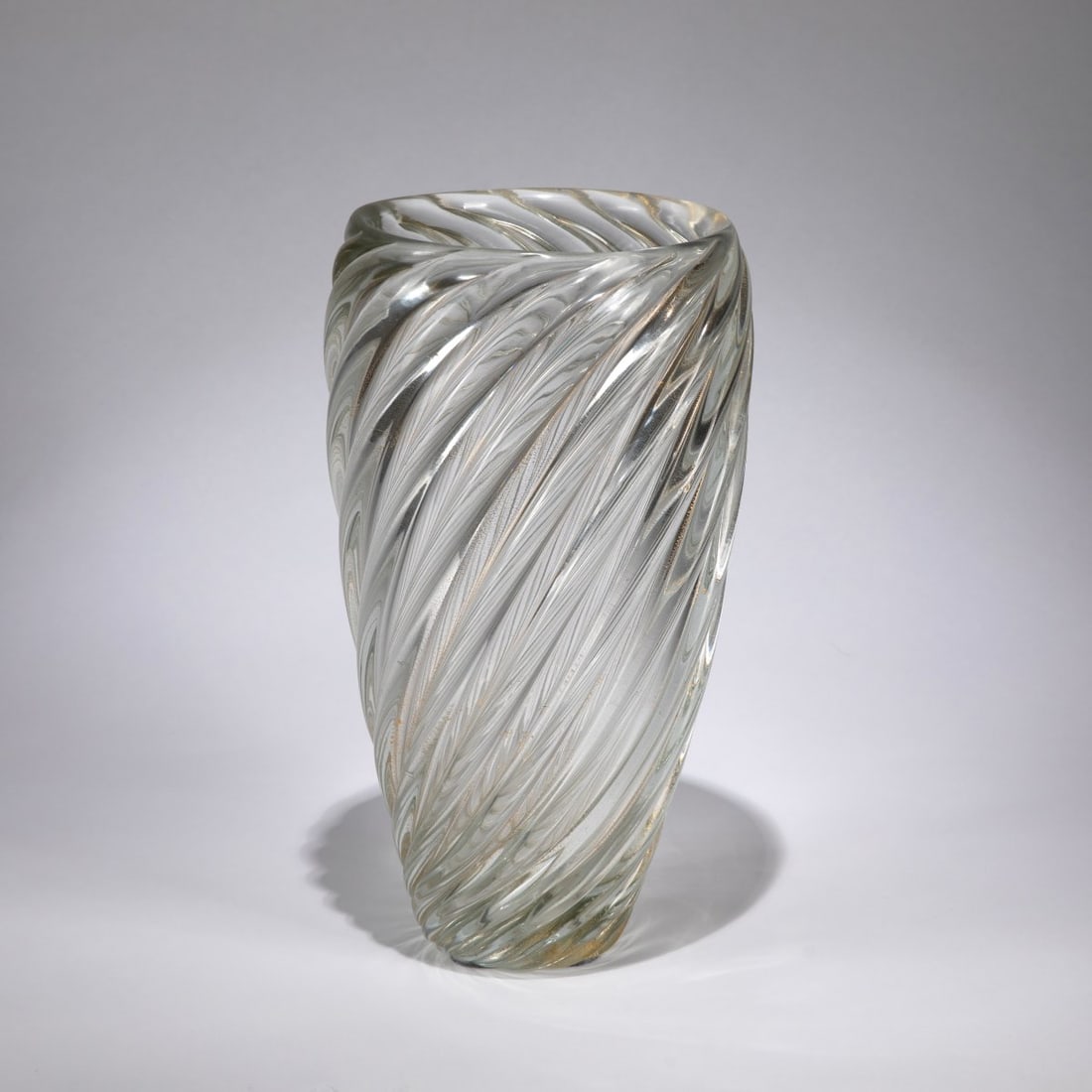 Venini, 'A coste' vase, c.1935: <p>H. 35 cm. Diagonally ribbed cased glass, colorless with gold foil. Marked: venini murano MADE IN ITALY (acid stamp).</p>