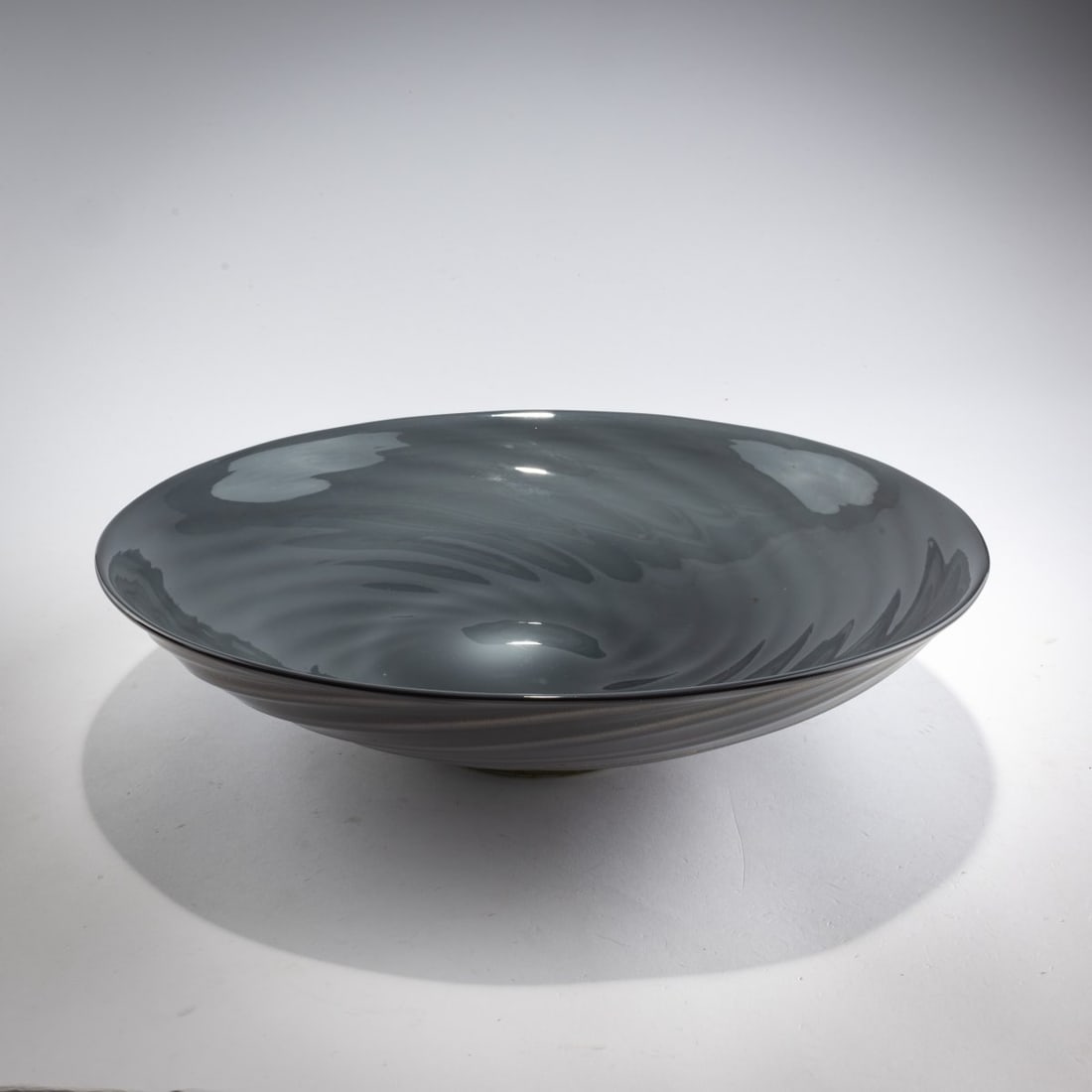 Flavio Poli, 'Grigio oro' bowl, c. 1936: <p>H. 8.8 cm, &Oslash; 36.5 cm. Execution: Barovier Seguso &amp; Ferro. Cased glass, clear, dark violet, and opal white; base is clear with finely burst gold foil. Marked on the bottom: