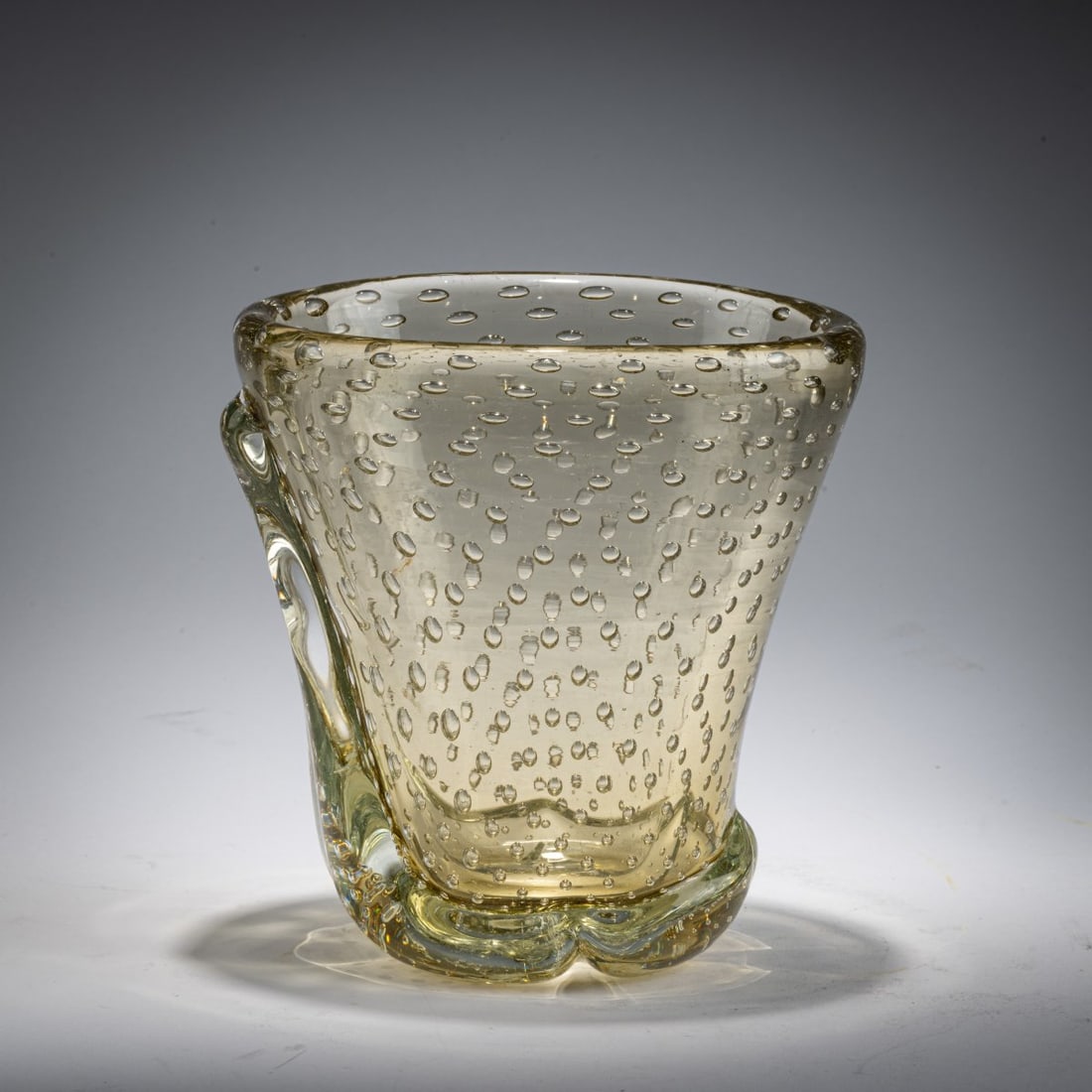 Carlo Scarpa, 'A bolle' vase, c. 1936: <p>Model No. 4105. H. 17 cm. Execution: Venini. Thick-walled glass with regularly pierced air bubbles, straw yellow. Marked on the base: venini murano (acid
