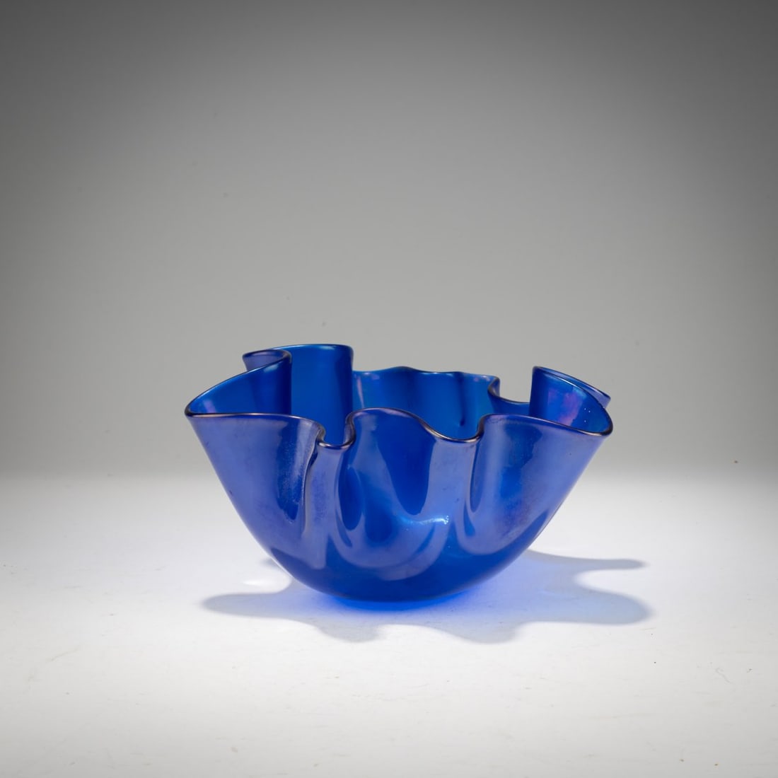 Fulvio Bianconi, 'Fazzoletto' vase, 1949/50: <p>H. 10.2 cm. Execution: Venini. Cased glass, blue, slightly iridescent on the inner side. Marked on the base: venini murano MADE IN ITALY (acid stamp).</p>
