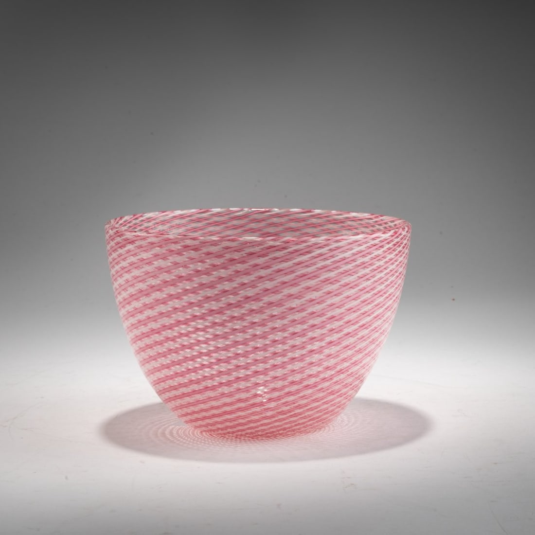 Venini, 'A reticello' bowl, c. 1950: <p>H. 11.7 cm; &Oslash; 17.2 cm. Colorless glass with pink and white meshwork. Marked on the base: venini murano ITALIA (acid stamp). </p>