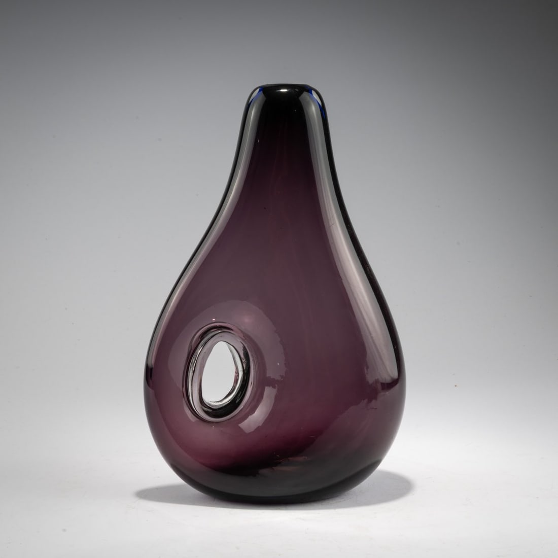 Fulvio Bianconi (1915, Padua – 1996, Milan), 'Forato' vase, 1951–52: <p>Model No. 4223. H. 32.5 cm. Execution: Venini. Cased glass, colorless and dark violet; round opening. Marked on the base: venini murano ITALIA (acid