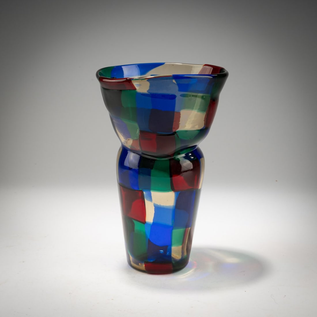 Fulvio Bianconi (1915, Padua – 1996, Milan), 'Pezzato' vase, c. 1951: <p>Model No. 4402. H. 19.9 cm. Execution: Venini. Cased glass, colorless with fused platelets in blue, red, green, and straw yellow. Marked on the base: venini murano ITALIA (acid