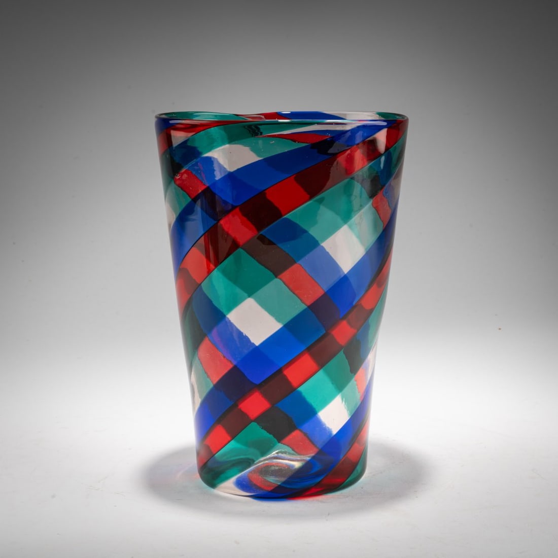 Fulvio Bianconi, 'A fasce ritorte' vase, c. 1951: <p>Model No. 4410. H. 22 cm, &Oslash; 15 cm. Execution: Venini. Colorless glass with applied bands running diagonally around the piece in dark red, blue, and turquoise.