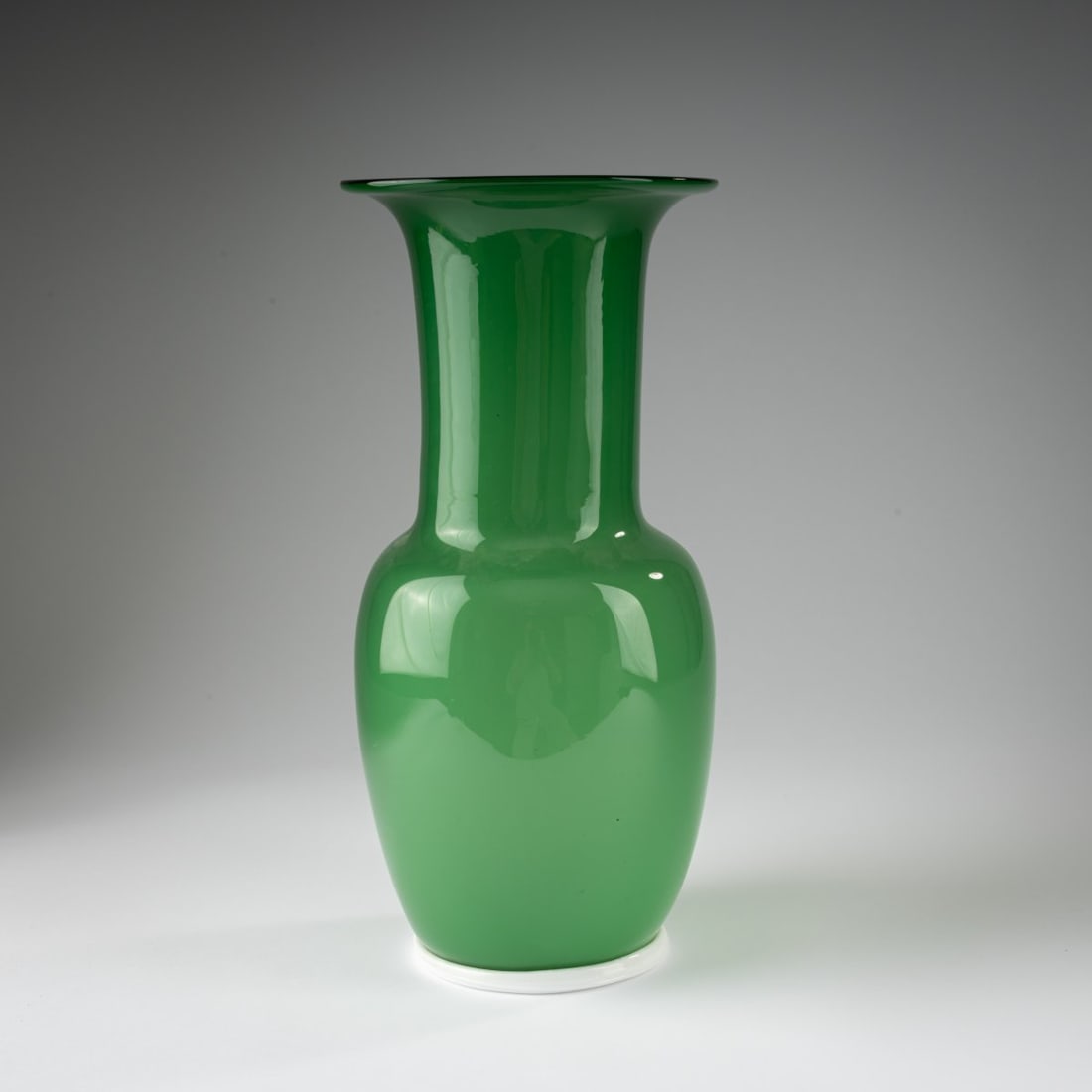 Venini, 'Opalino' vase, c. 1952: <p>H. 36.7 cm. Cased glass, colorless, opalescent white, and green; white base ring. Marked on the base: venini murano ITALIA (acid stamp).</p>