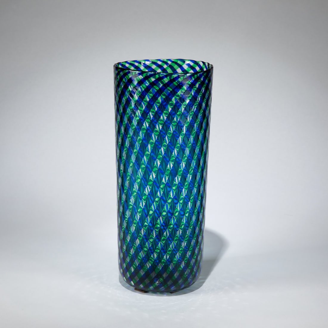 Fulvio Bianconi, 'A reticello' vase, 1955: <p>H. 36 cm. Execution: Venini. Cased glass, colorless with interlacing bands of green and blue and bubble inclusions. Marked: Manufacturer's label with handwritten numbering 4...