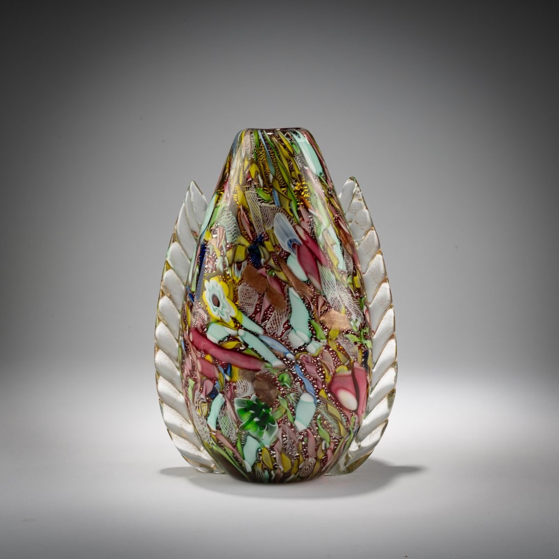 A.Ve.M., 'Bizantino' vase, 1956: <p>Model No. 13585. H. 26.3 cm. Cased glass, colorless and red, with fused polychrome murrine and bands, finely burst metal foil, and handles made of clear glass.