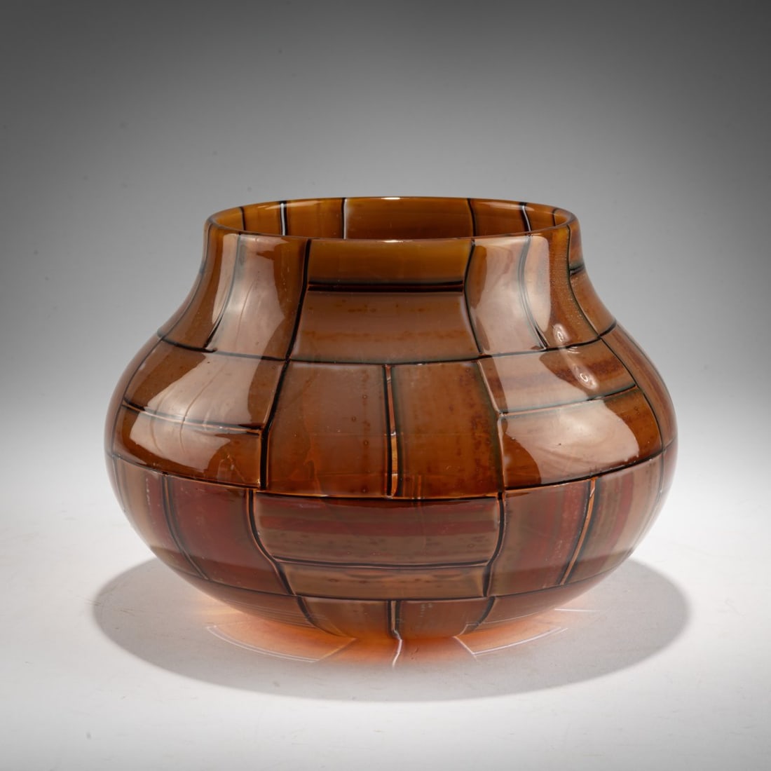 Ercole Barovier, 'Tessere Ambra' vase, 1957: <p>H. 16.3 cm. Execution: Barovier &amp; Toso. Colorless glass with fused, rectangular glass platelets in ochre brown and opalescent white with metal oxides, dark violet rim. Marked on the