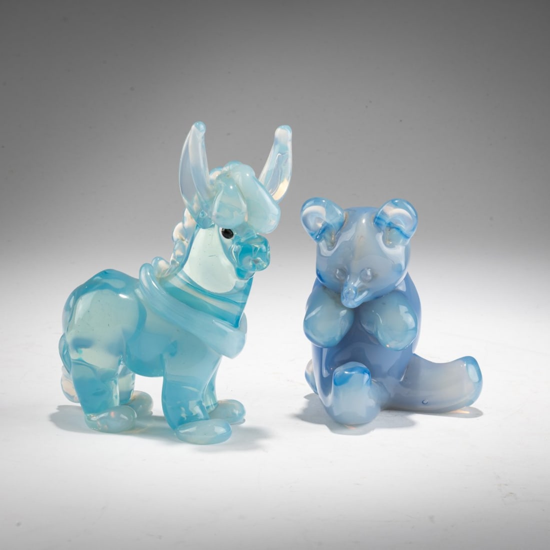 Seguso Vetri d'Arte, Two 'Opalino' animals, 1957–59: <p>Bear: Model No. 11694. H. 10.5 cm; donkey similar to Model No. 12292. H. 14.5 cm. Colorless and blue-tinted glass, partially underlaid with opal. Bear marked on the base: Seguso Murano (engra