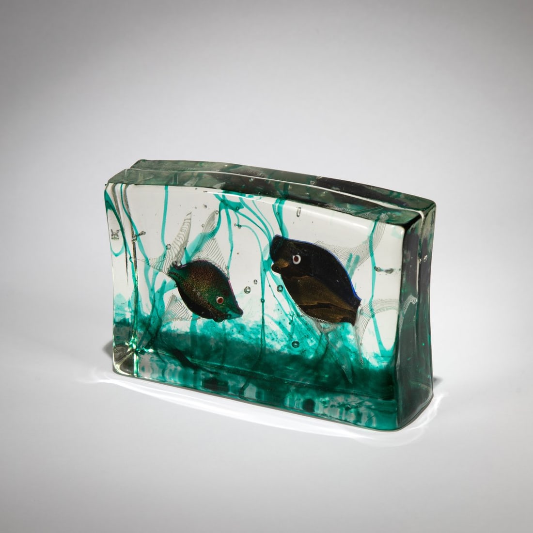 Cenedese, Aquarium, c. 1960: <p>H. 13 cm; 20 x 5.5. Colorless glass block with polychrome inclusions.</p>