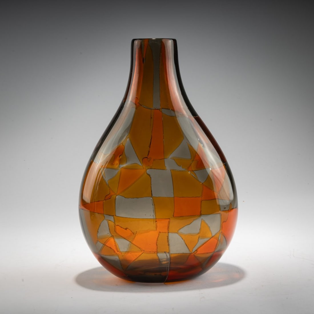 Ercole Barovier, 'Intarsio' vase, 1961-1963: <p>Drop shape, flattened on both sides. H. 31 cm. Execution: Barovier &amp; Toso. Colorless glass with fused triangular platelets in dark yellow and gray-blue.