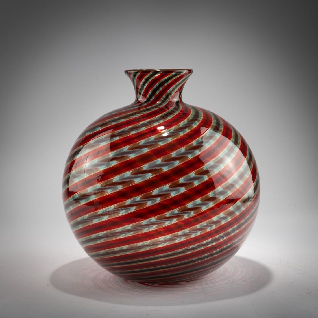 Ercole Barovier, 'Spira aurata' vase, c. 1966: <p>Bulbous spherical shape. H. 33 cm. Execution: Barovier &amp; Toso. Colorless glass with applied diagonal ribbons in red, green, and violet, and finely burst gold foil. Marked on the base: