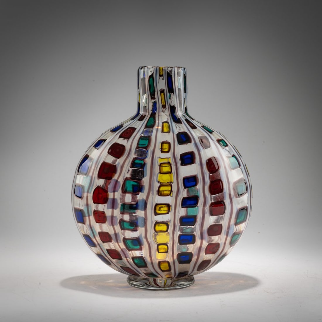 Ercole Barovier, 'Diamantati' vase, 1968: <p>H. 31 cm. Execution: Barovier &amp; Toso. Colorless glass with squares in yellow, blue, red, and green fused in vertical rows and outlined in dark violet, separated by dark violet threads