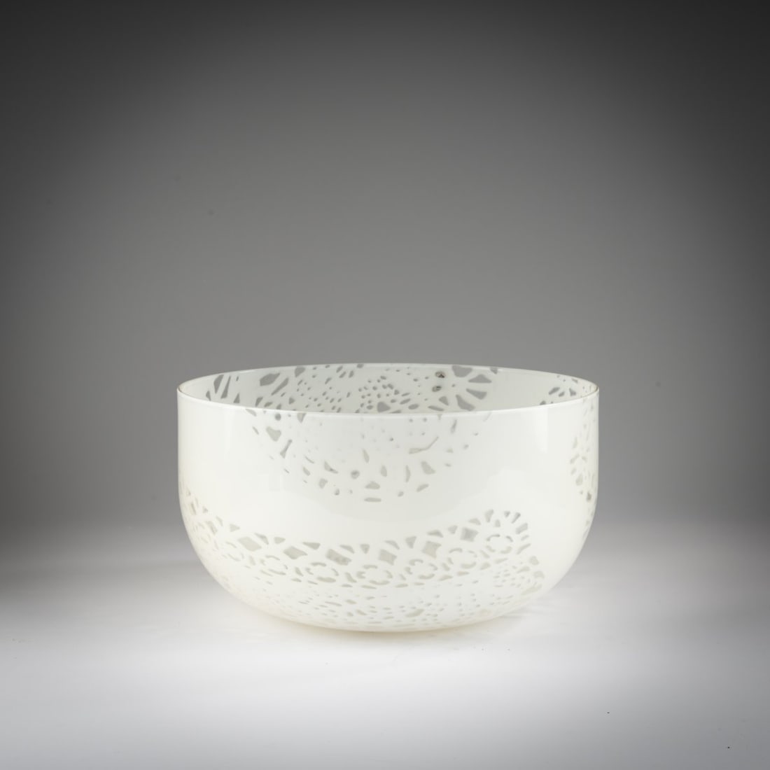 Owe Thorssen; Birgitta Karlsson, 'Merletto' bowl, 1981: <p>H. 15.3 cm, &Oslash; 29.2 cm. Execution: Venini &amp; C. Colorless glass, honeycomb-patterned layered fusing in opaque white. Marked on the base: venini italia, artist&rsquo;s mon