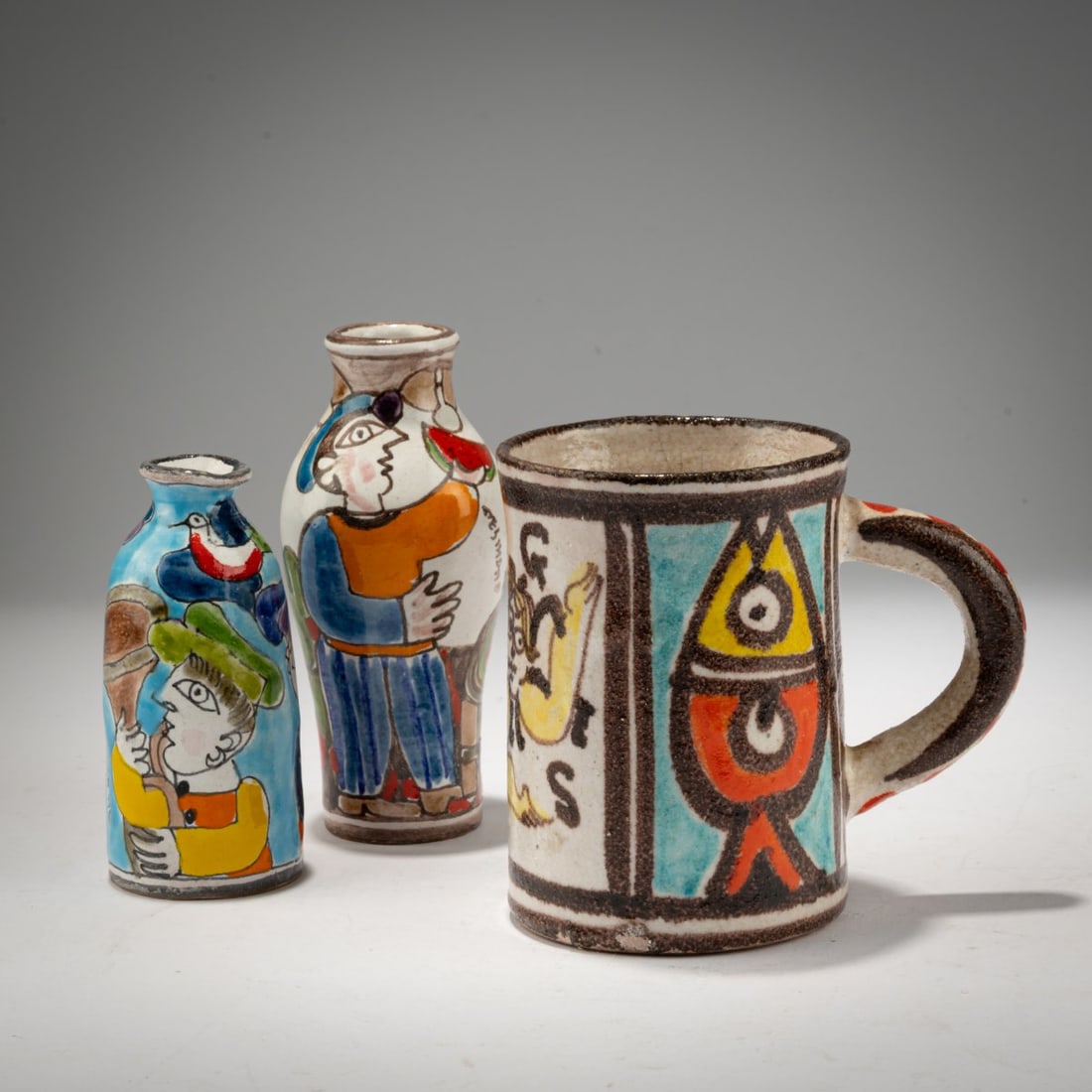 Giovanni De Simone, Two vases and one cup, 1980s: <p>H. 9.5 &ndash; 12 cm.<br />Desimone, Palermo.<br />Majolica, polychrome on a white glaze.<br />Marked: Desimone, various inscriptions (black, handwritten), label. </p