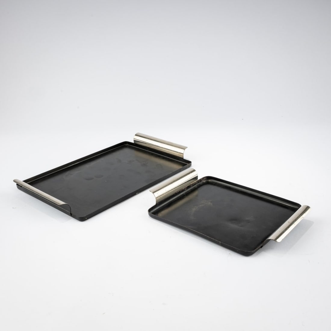 Marianne Brandt , Two trays, 1929–32 (Design): <p>17 x 22 cm, 18.5 x 30 cm. <br />Ruppelwerk, Gotha.<br />Brass sheet, black lacquered or chrome-plated.<br />Marked: Ruppel protected</p>
