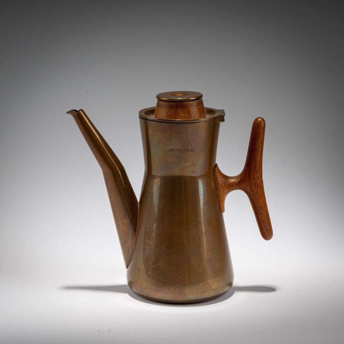 Tapio Wirkkala , 'TW 163–164' coffee pot, 1961 (design): <p>H. 16 cm.<br />Hopeakeskus Oy, H&auml;meenlinna.<br />Curved sheet metal, silver-plated on the inside, teak.<br />Marked: Manufacturer's mark, DESIGN: TAPIO