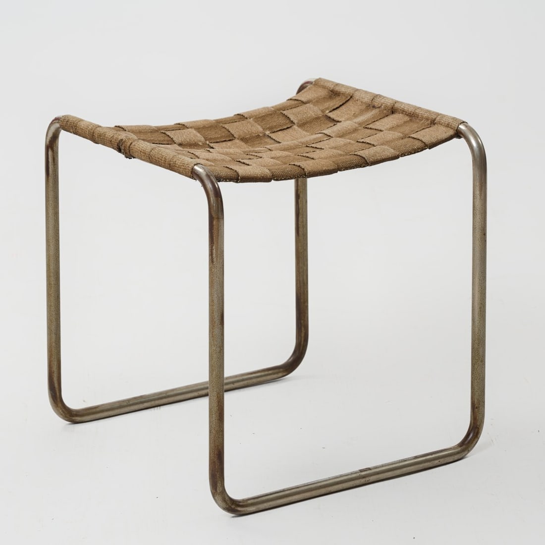 Ludwig Mies van der Rohe (in the style of), Stool similar to 'MR 1', 1927 (design): <p>H. 46.5 x 46 x 44.5 cm, tube: &Oslash; 20 mm.<br />Germany.<br />Chrome-plated steel tube, fabric covering.</p><hr><p>Literature:</p><p>Cf.