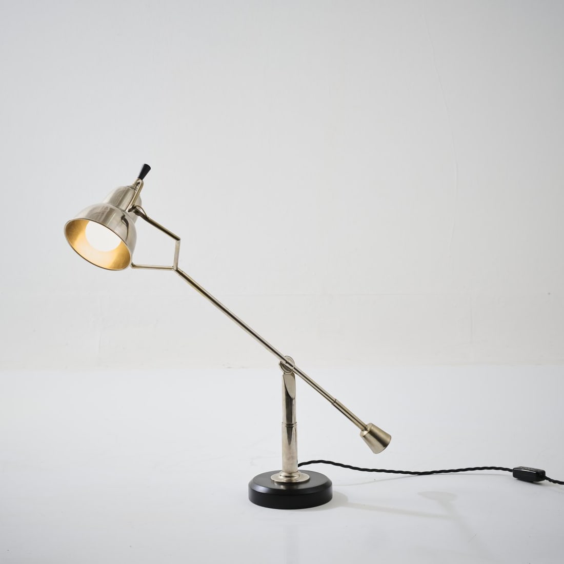 Edouard Wilfrid Buquet, 'Buquet' table light, 1927 (design): <p>H. 62 cm. <br />France, probably 1980s/90s. <br />Tubular metal, copper and nickel plated, aluminum shade, bakelite, wood, painted black. </p><hr><p>Literature:&