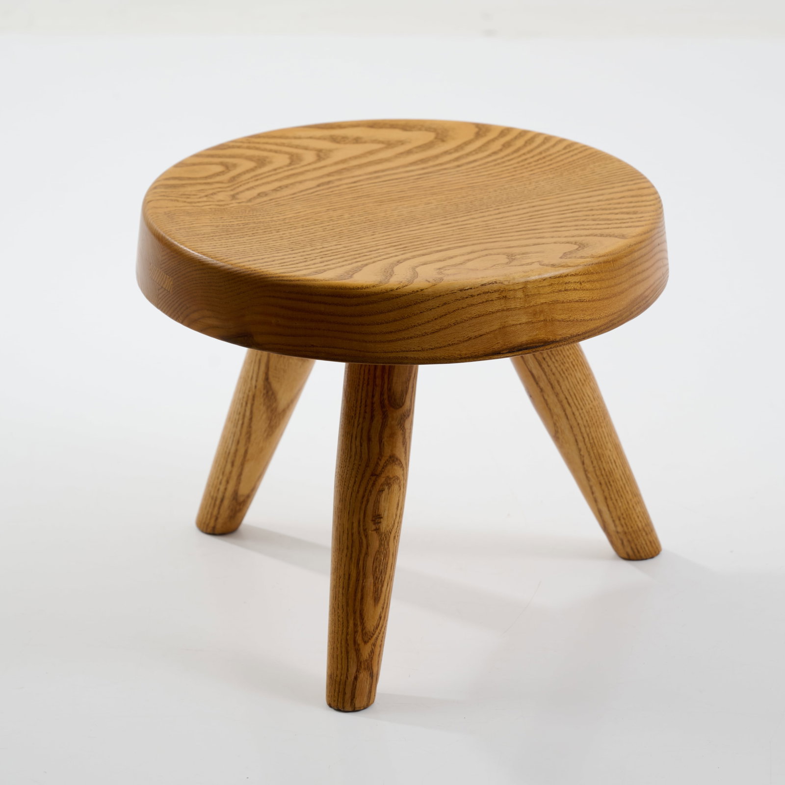Charlotte Perriand, Stool 'Berger', 1938 (design): <p>H. 27 cm; &Oslash; 31.5 cm. B<br />lanchon, Paris; Sentou, Paris; Steph Simon, Paris. <br />Ash wood, solid.</p><hr><p>Literature:</p><p>Cf.