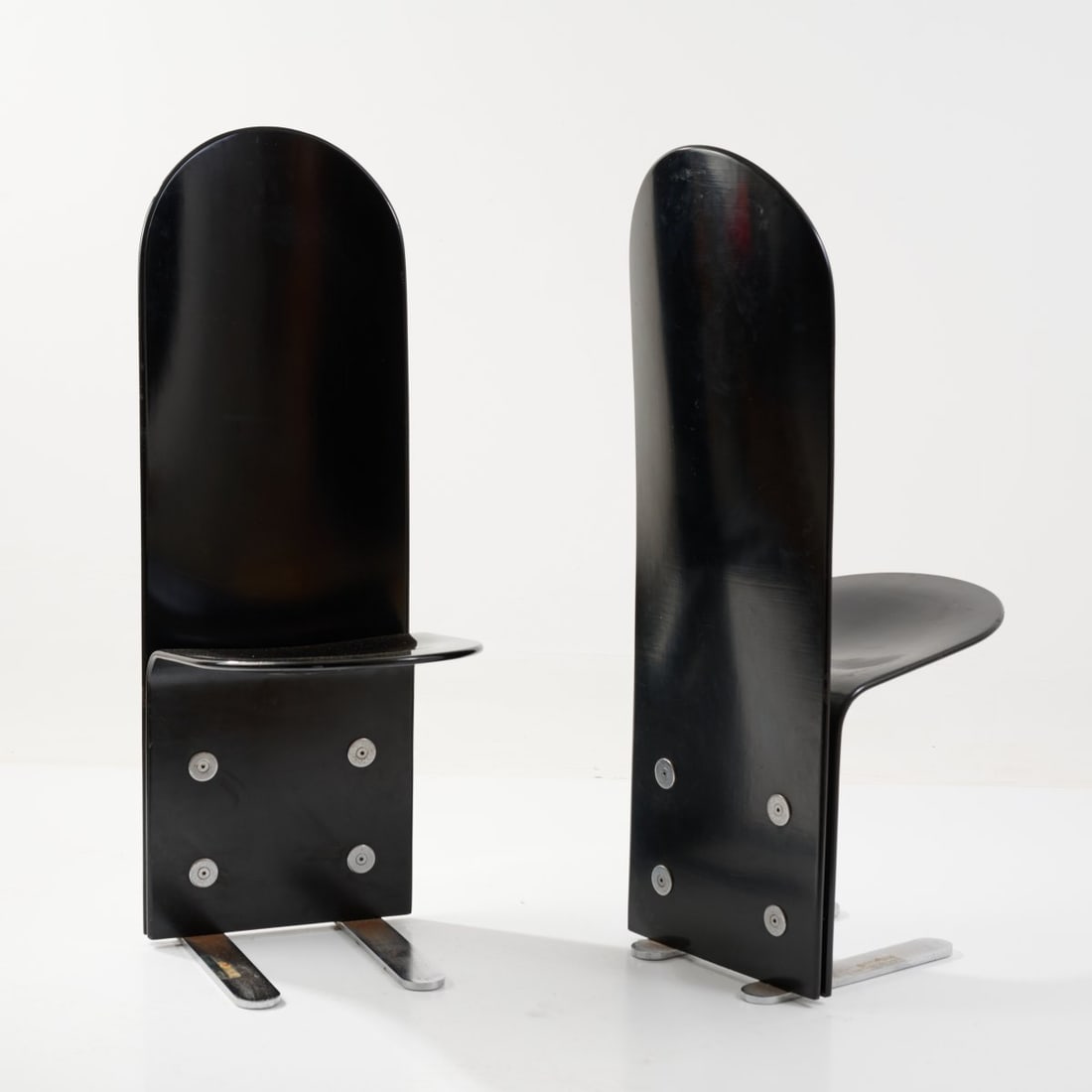 Luigi Saccardo, Two 'Pellicano' chairs, c. 1970 (design): <p>H. 110 x 39 x 50 cm. <br />Arrmet, Manzano. <br />Plywood, painted black, sheet metal. <br />Marked: Label with manufacturer and designer