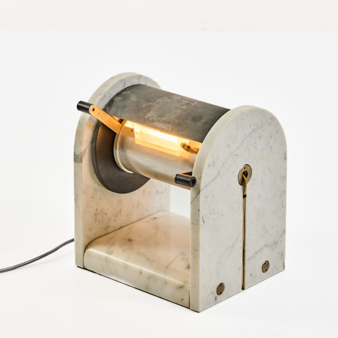 Andrea Bellosi, 'Arc en ciel' table light, 1980 (design): <p>H. 28 x 25 x 21 cm.<br />Studio Alchimia, Milan.<br />White marble, sheet metal, partially painted black, black plastic, acrylic glass lens.<br />Marked: ARC-EN-CIEL A. BELL