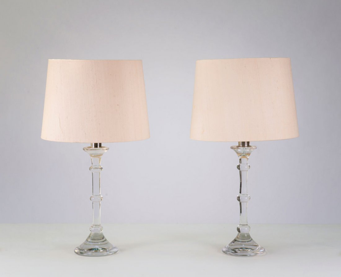 Pair of 'Tiffany' table lights: Ingo Maurer. Pair of 'Tiffany' table lights, 1967. H. 78,5 cm; D. 42 cm. Made by Design M, Ingo Maurer, Munich. Glass base, creme-white fabric shade. Marked: Maker's labels.