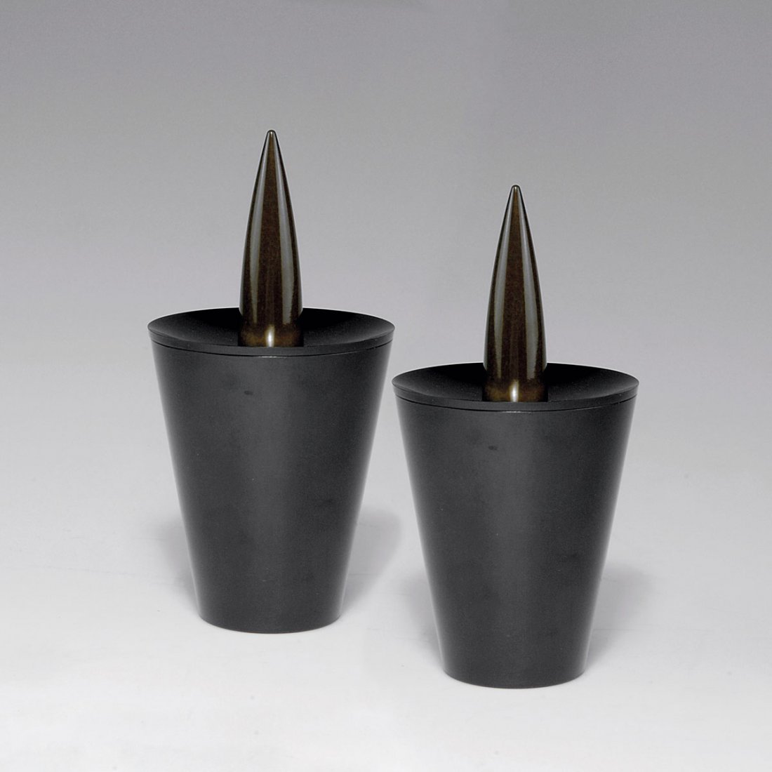 Pair of 'Joe Cactus' ash trays, 1990: Philippe Starck. Pair of 'Joe Cactus' ashtrays, 1990. H. 20 cm; D. 10.2 cm. Made by Officina Alessi, Portugal. Bakelite, black and green. Marked: OFFICINA ALESSI PORTUGAL, STARCK.