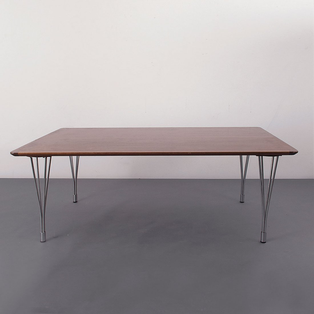 Coffee table: Bruno Mathsson; Piet Hein. Coffee table, c1968. H. 51.5 x 140 x 90 cm. Made by Bruno Mathsson AB, V_rnamo (attributed). Blockboard, rosewood veneer, chrome-plated tubular steel.