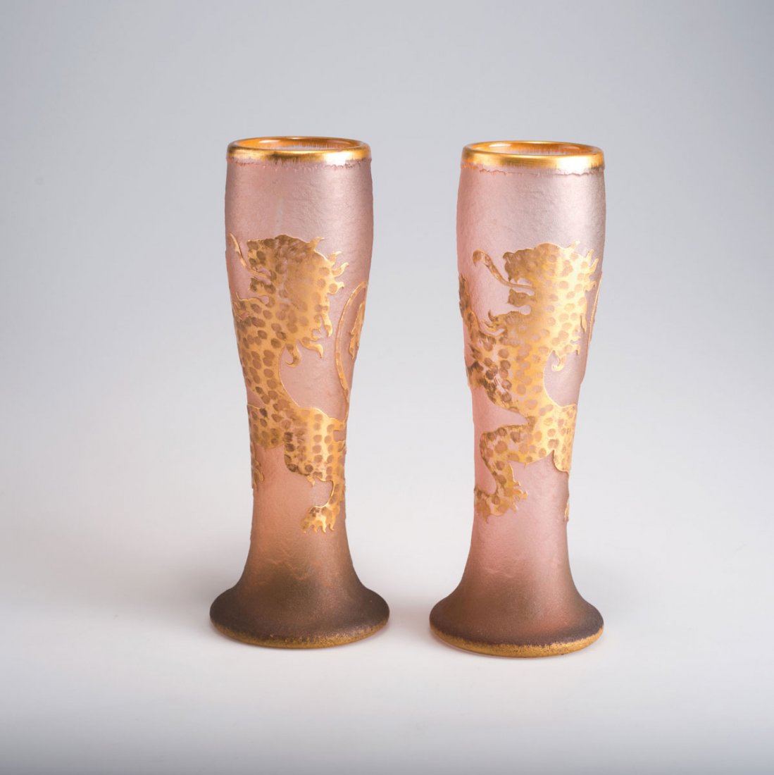 Daum Freres, Nancy. Pair of vases with lion of: Daum Freres, Nancy. Pair of vases with lion of Lorraine, c1895. H. 29.5 cm. Cased glass, clear and salmon pink. Reliefed standing lion on rough ground. Marked: Daum Nancy, cross of Lorraine.